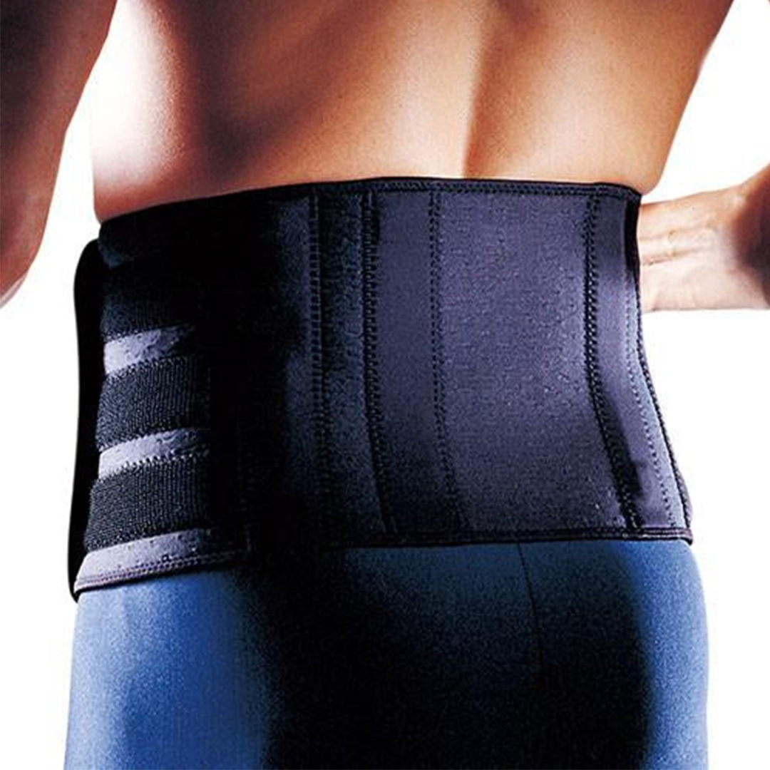 Person wearing a black waist support belt on a white background