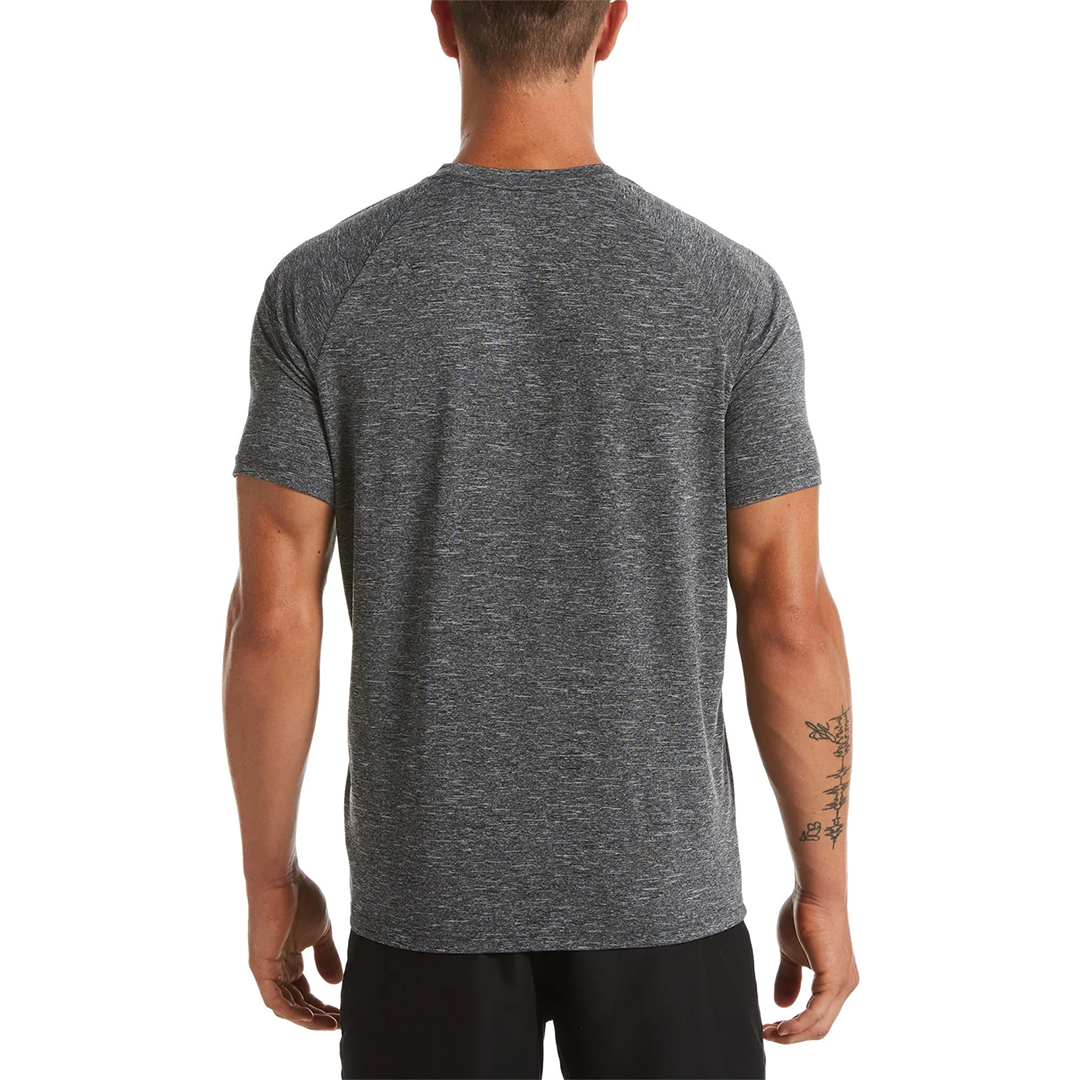 Person wearing a gray athletic shirt on a white background