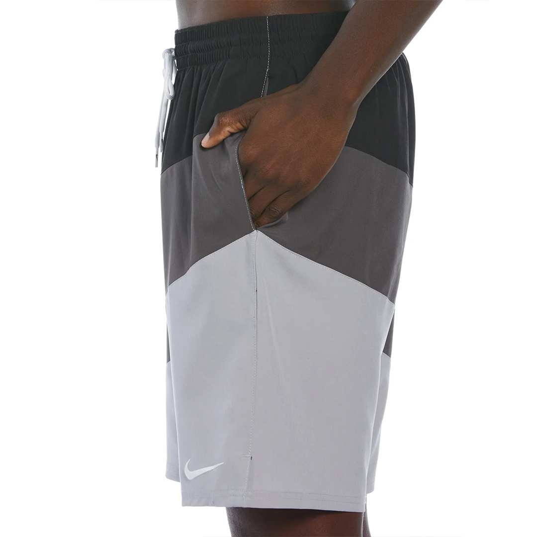 Gray and black athletic shorts with a Nike logo on a white background