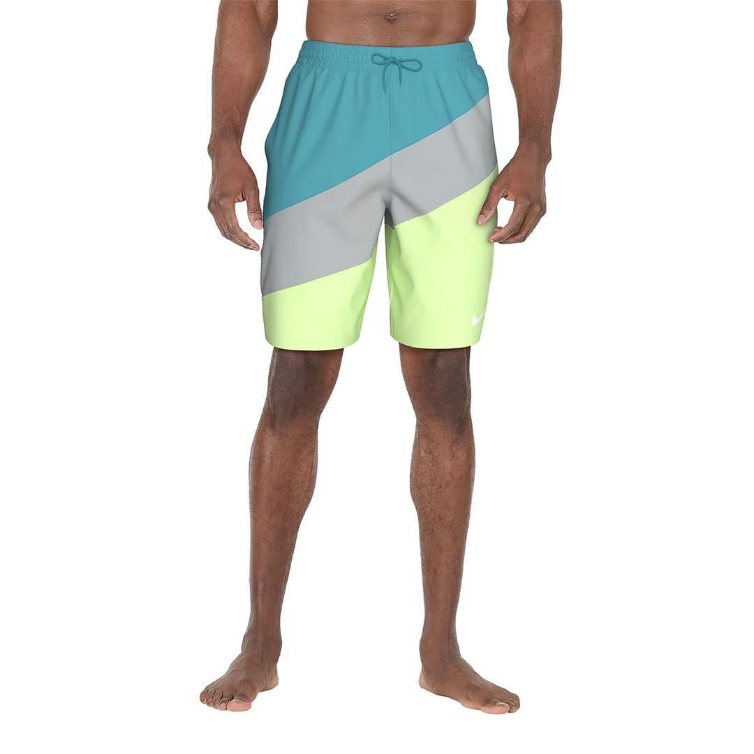 Color-blocked swim shorts with blue, gray, and yellow sections on a white background