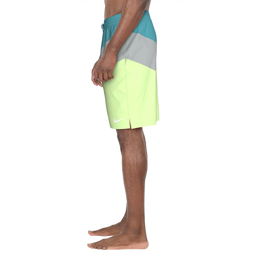 Color-blocked swim shorts worn by a person on a white background
